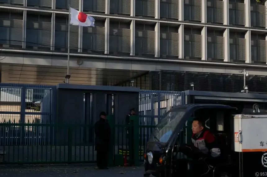 China and Japan flags symbolize growing trade and diplomatic tensions. - AP Photo/Ng Han Guan