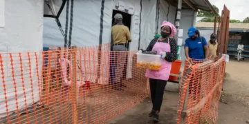 Volunteers prepare meals for Ebola patients in Bunia - AP Photo/Moses Sawasawa