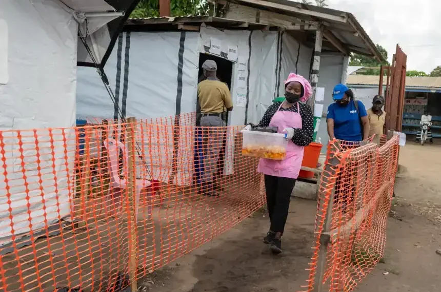 Volunteers prepare meals for Ebola patients in Bunia - AP Photo/Moses Sawasawa