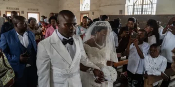 Newlyweds celebrate under Ebola restrictions in eastern Congo - AP Photo/Moses Sawasawa
