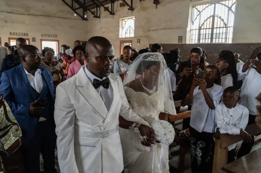 Newlyweds celebrate under Ebola restrictions in eastern Congo - AP Photo/Moses Sawasawa