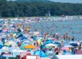 People seek shade during record-breaking heat across European cities - Stefan Sauer/dpa via AP