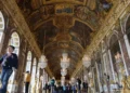 Donald Trump and Emmanuel Macron at Versailles palace event - AP Photo/Amr Nabil, File