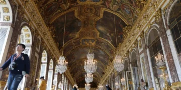 Donald Trump and Emmanuel Macron at Versailles palace event - AP Photo/Amr Nabil, File