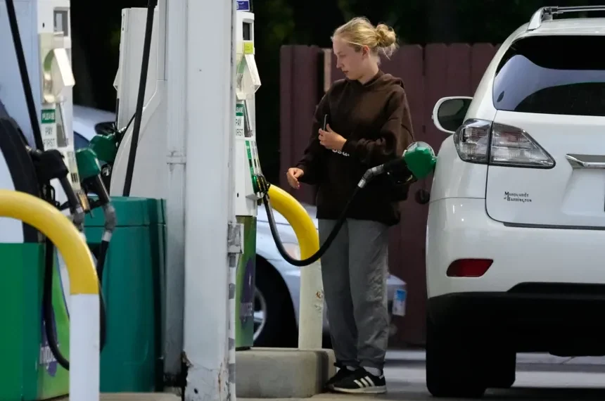 Gas station price boards showing falling fuel prices - AP Photo/Nam Y. Huh