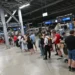 Passengers waiting during Germany rail network disruption at station - Peter Kneffel/dpa via AP