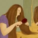 Woman brushing long hair as part of daily care - BBC/ Prashanti Aswani