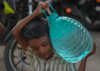 Residents collect water as delayed monsoon affects Indian cities and farms - AP Photo/Rafiq Maqbool