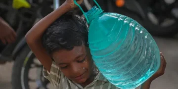Residents collect water as delayed monsoon affects Indian cities and farms - AP Photo/Rafiq Maqbool