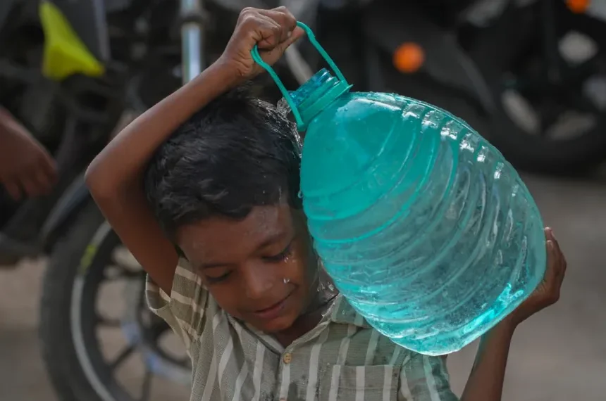 Residents collect water as delayed monsoon affects Indian cities and farms - AP Photo/Rafiq Maqbool