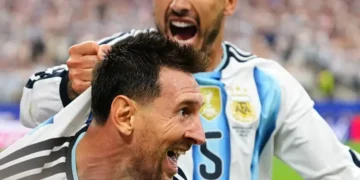 Lionel Messi celebrates after scoring against Austria at World Cup - AP Photo/Julio Cortez