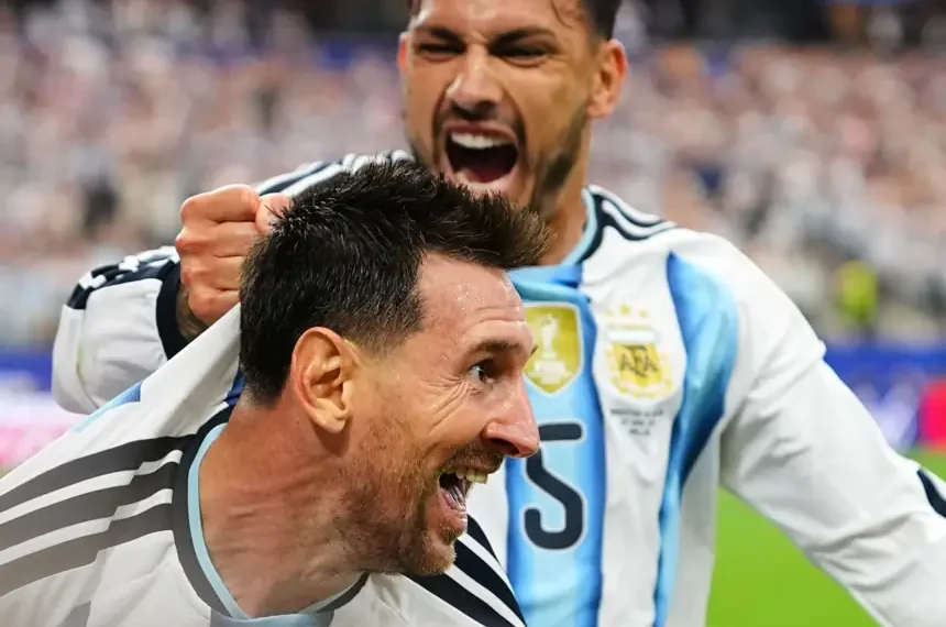 Lionel Messi celebrates after scoring against Austria at World Cup - AP Photo/Julio Cortez