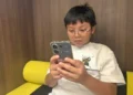 Malaysian family reacts to new social media age restrictionsHew Chee Weng, 11, uses smartphone in Kuala Lumpur, Malaysia, Monday, June 1, 2026 - AP Photo/Syawalludin Zain