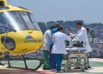 Rescued Sherpa guide after surviving days on Mount Everest - AP Photo/Niranjan Shrestha - CORRECTION: Corrects hospital name to HAMS not Grande