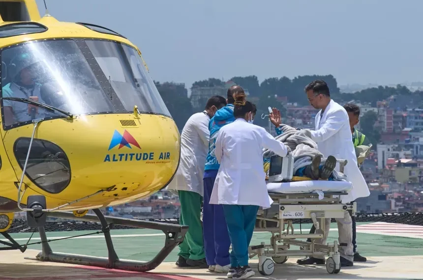Rescued Sherpa guide after surviving days on Mount Everest - AP Photo/Niranjan Shrestha - CORRECTION: Corrects hospital name to HAMS not Grande