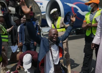 Nigerian migrants arrive home after returning from South Africa - AP Photo/Sunday Alamba