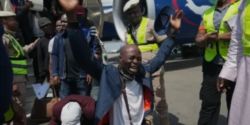 Nigerian migrants arrive home after returning from South Africa - AP Photo/Sunday Alamba
