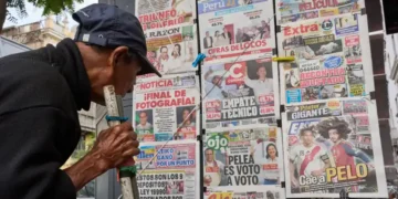 Election workers process ballots during Peru presidential runoff count - AP Photo/Rodrigo Abd