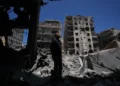 Residents inspect damaged homes in southern Lebanon - AP Photo/Hassan Ammar