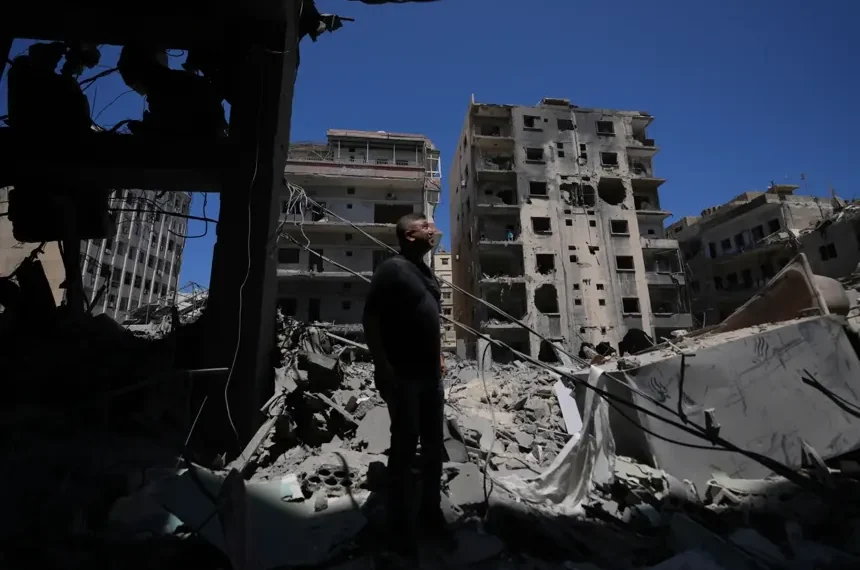 Residents inspect damaged homes in southern Lebanon - AP Photo/Hassan Ammar