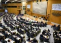 Swedish parliament debates new migrant reporting legislation - Fredrik Sandberg/TT News Agency via AP