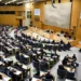 Swedish parliament debates new migrant reporting legislation - Fredrik Sandberg/TT News Agency via AP