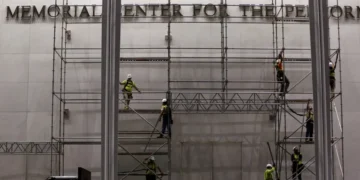Workers remove Trump’s name from the Kennedy Center facade - AP Photo/Rahmat Gul