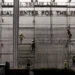 Workers remove Trump’s name from the Kennedy Center facade - AP Photo/Rahmat Gul