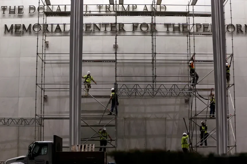 Workers remove Trump’s name from the Kennedy Center facade - AP Photo/Rahmat Gul