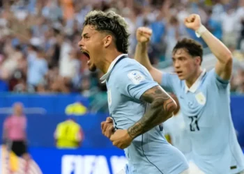 Uruguay and Saudi Arabia players contesting World Cup Group H match - AP Photo/Lynne Sladky