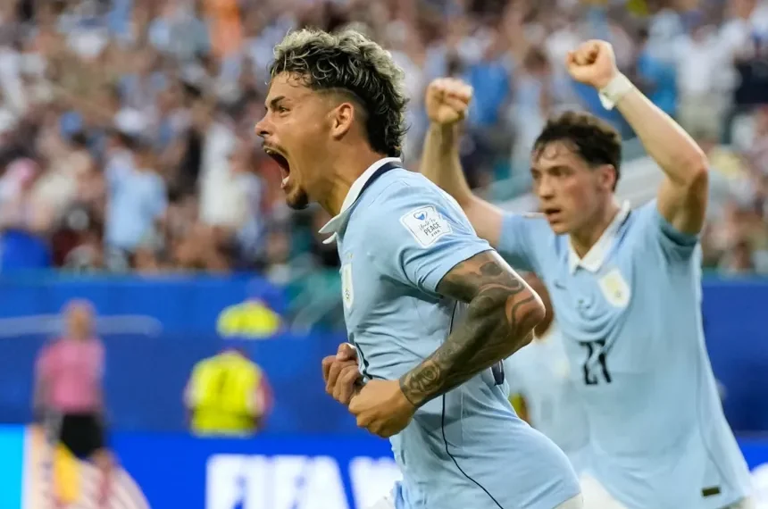 Uruguay and Saudi Arabia players contesting World Cup Group H match - AP Photo/Lynne Sladky