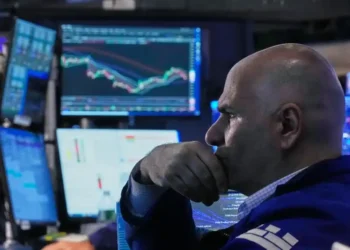 Traders monitor rising U.S. stock indexes during Wall Street trading session. - AP Photo/Richard Drew