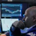 Traders monitor rising U.S. stock indexes during Wall Street trading session. - AP Photo/Richard Drew