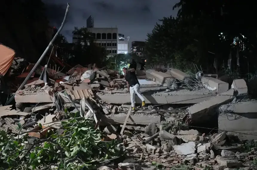 Damaged buildings and emergency response efforts after earthquakes in Caracas - AP Photo/Adrian Naranjo