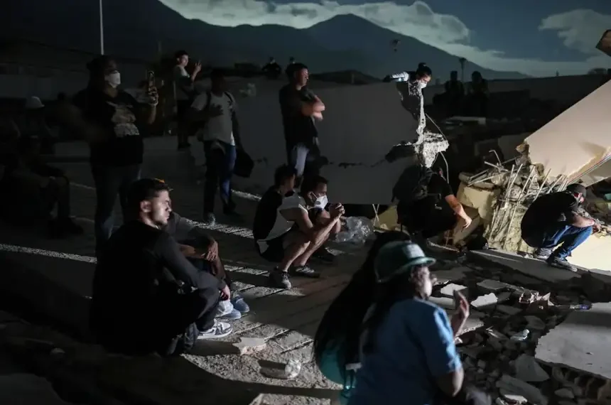 Rescue workers search collapsed buildings after devastating earthquakes in Venezuela. - AP Photo/Matias Delacroix