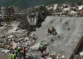 Rescue workers search collapsed buildings after devastating Venezuela earthquakes. - AP Photo/Matias Delacroix