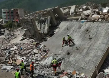 Rescue workers search collapsed buildings after devastating Venezuela earthquakes. - AP Photo/Matias Delacroix