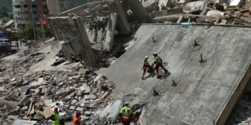 Rescue workers search collapsed buildings after devastating Venezuela earthquakes. - AP Photo/Matias Delacroix