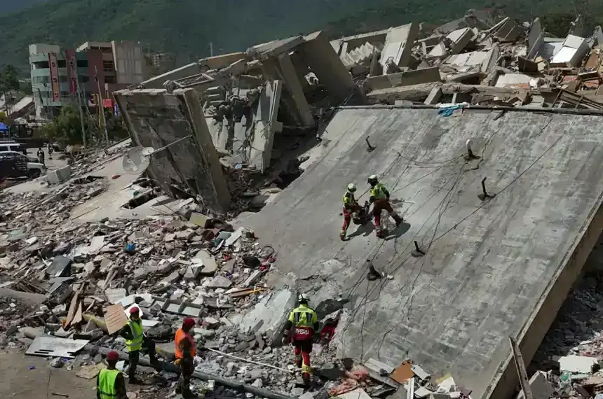 Rescue workers search collapsed buildings after devastating Venezuela earthquakes. - AP Photo/Matias Delacroix