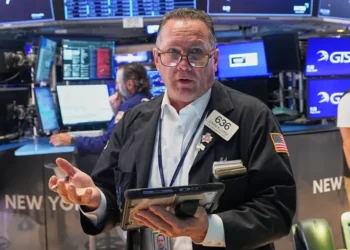 Traders monitor stock market performance as AI shares decline. - AP Photo/Richard Drew