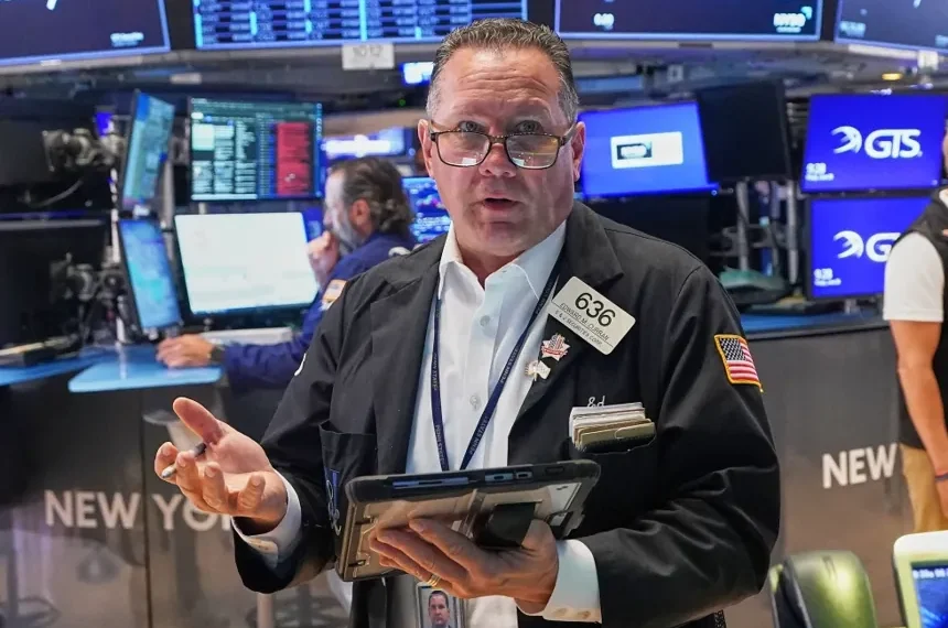 Traders monitor stock market performance as AI shares decline. - AP Photo/Richard Drew