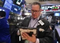 Traders monitor markets as oil prices rise and stocks advance - AP Photo/Richard Drew