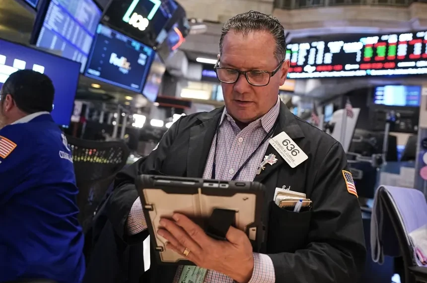 Traders monitor markets as oil prices rise and stocks advance - AP Photo/Richard Drew