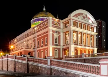 Exterior view of the historic Amazon Theatre in Manaus, Amazonas, Brazil, illuminated at night.
