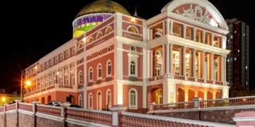 Exterior view of the historic Amazon Theatre in Manaus, Amazonas, Brazil, illuminated at night.