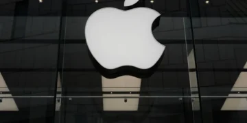 Apple and OpenAI logos representing trade secrets lawsuit over AI hardware - AP Photo/Matthias Schrader, File