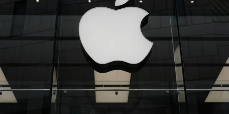 Apple and OpenAI logos representing trade secrets lawsuit over AI hardware - AP Photo/Matthias Schrader, File