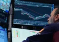 Investors monitor Asian stock markets alongside oil and currency developments. - AP Photo/Richard Drew