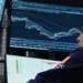 Investors monitor Asian stock markets alongside oil and currency developments. - AP Photo/Richard Drew