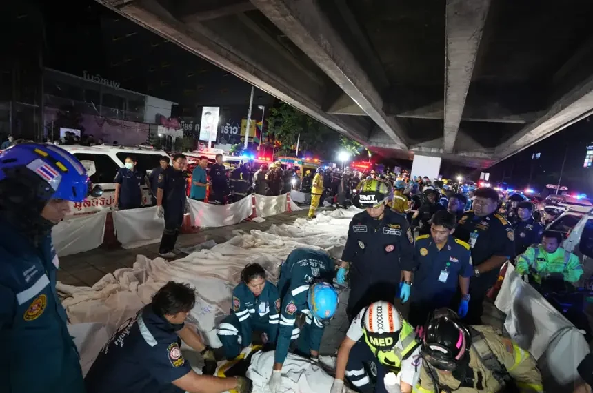 Emergency responders work at the scene of a deadly pub fire in Bangkok. - AP Photo/Sakchai Lalit